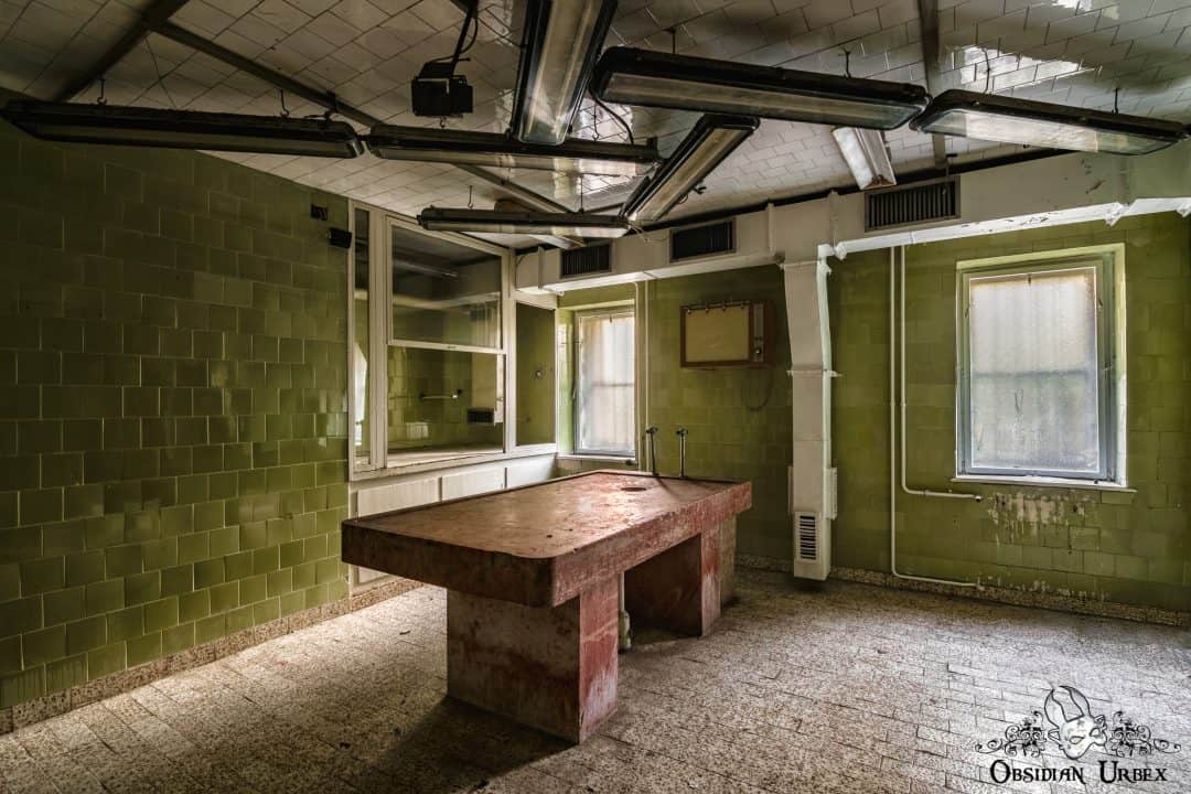 Red Morgue Hungary abandoned mortuary slab lights from side