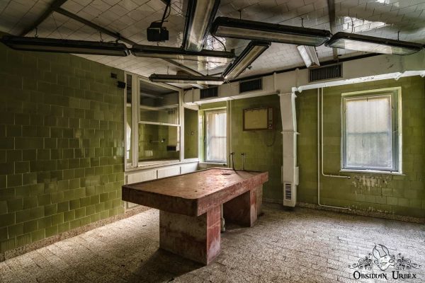 Red Morgue Hungary abandoned mortuary slab lights from side