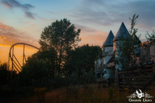 Camelot Theme Park England UK Abandoned Castle and Rollercoaster at Sunset